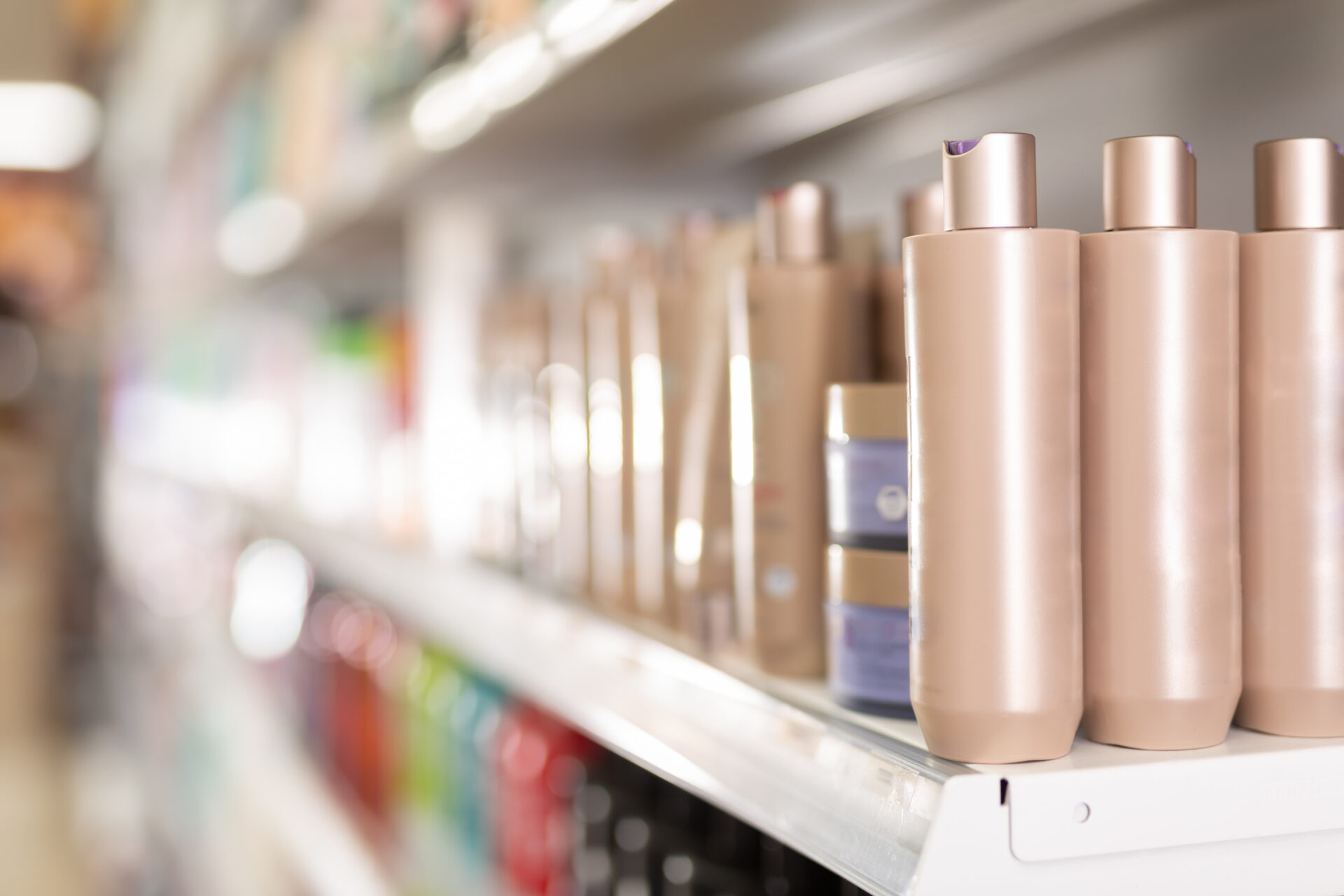 Hair care products on store shelves in supermarket